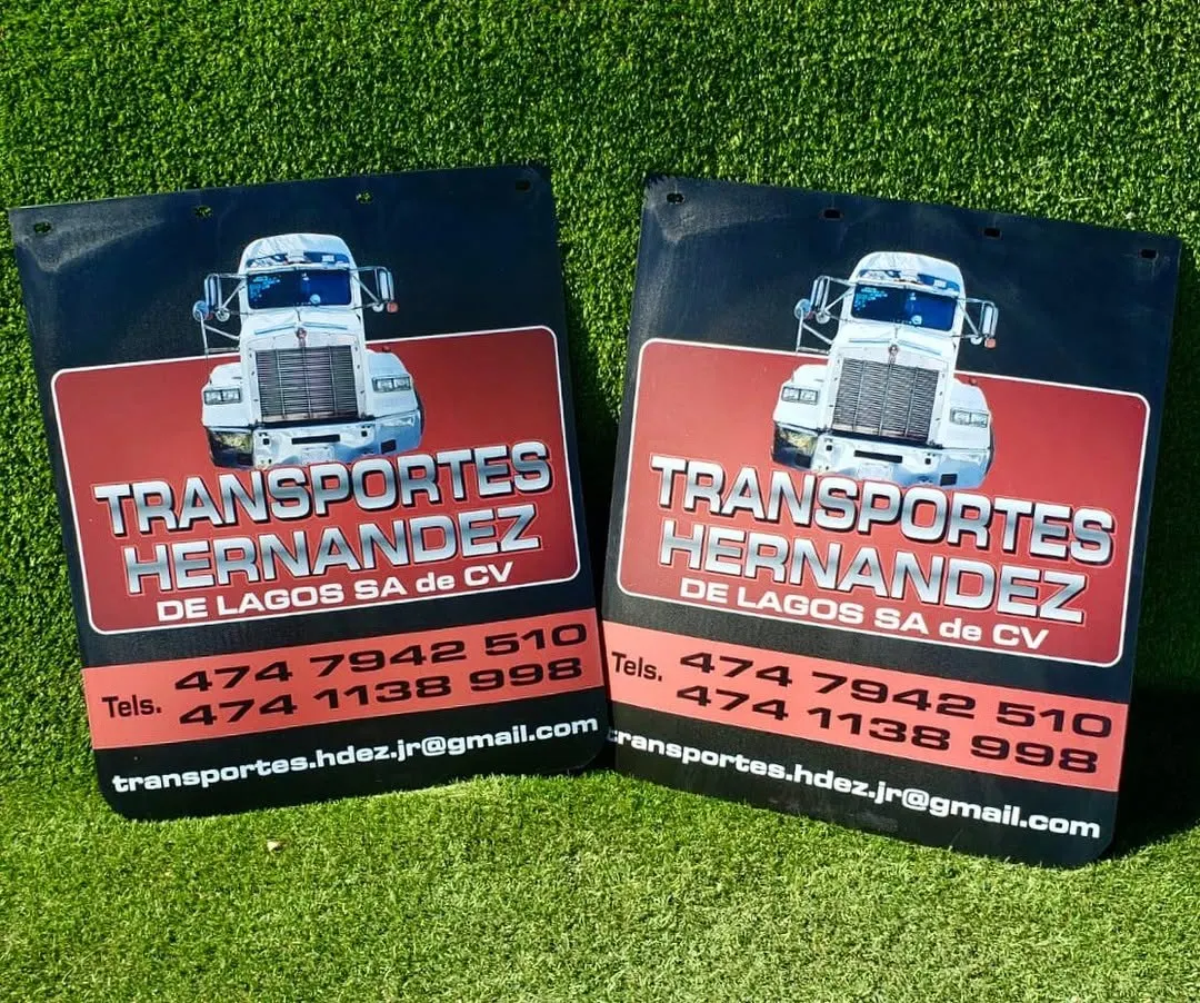 Loderas negras con recuadro rojo, ilustración de tractocamión y teléfonos de empresa de transportes